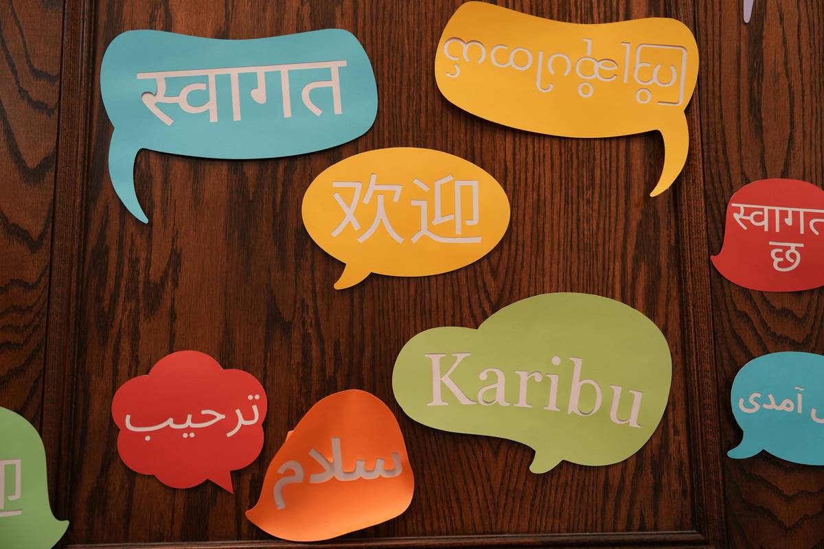 Team collaborating on multilingual corporate training strategies with localized visuals and scripts
